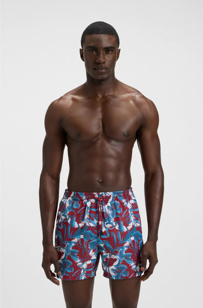 LOGO-BADGE SWIM SHORTS WITH ALL-OVER PRINT