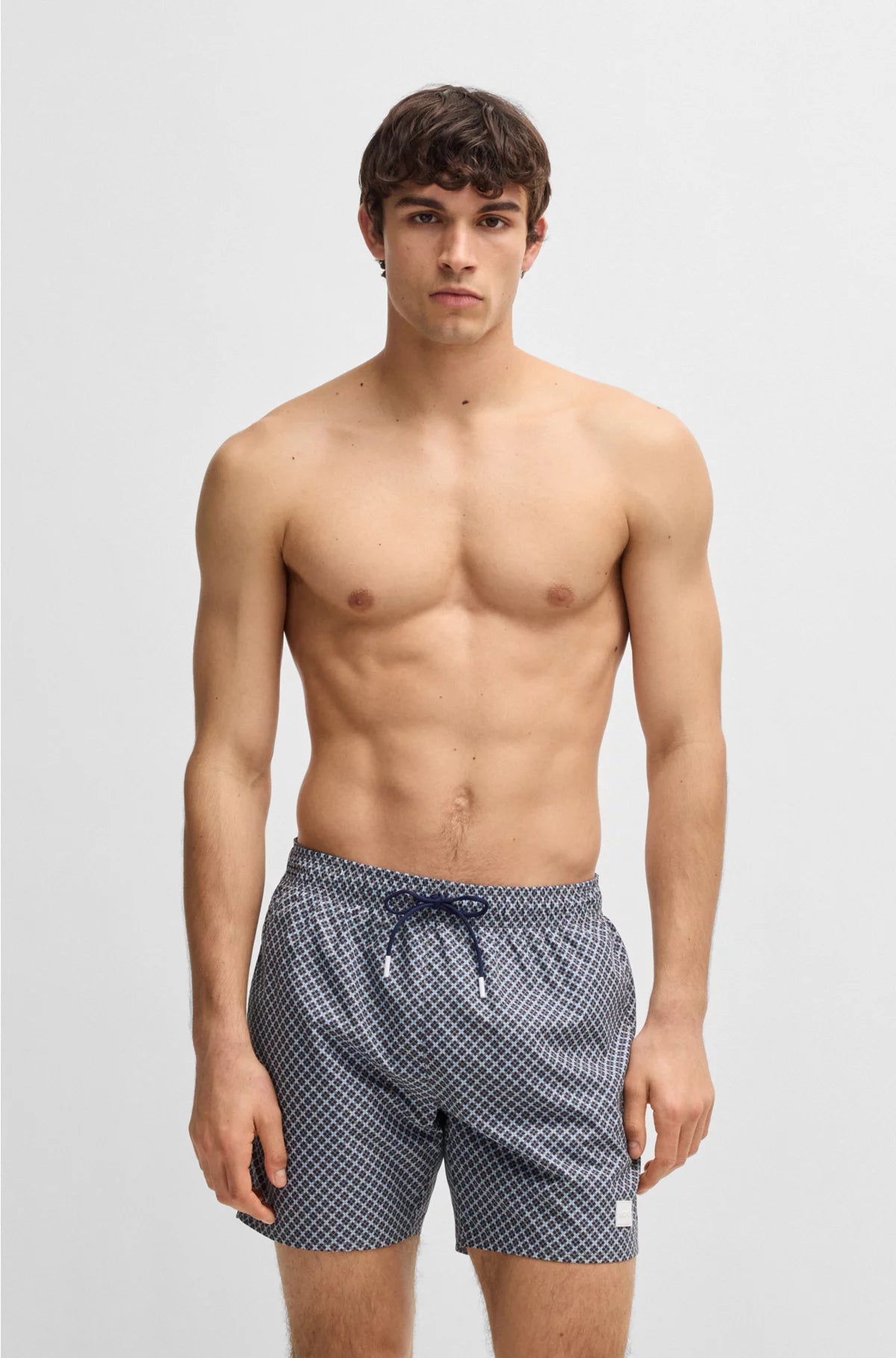 PRINTED SWIM SHORTS WITH LOGO BADGE